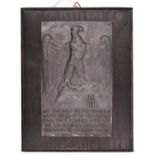 A Third Reich SS plaque, black metal with eagle and runes, inscribed “Die Aufgabe Dieser Front 1st