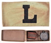 A Third Reich RLB service award, in its original card case; also a green armband with printed “