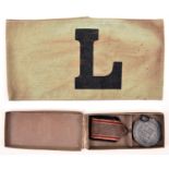 A Third Reich RLB service award, in its original card case; also a green armband with printed “