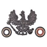 A WWI Prussian grey steel pickelhaube helmet badge, painted black; and a pair of matching
