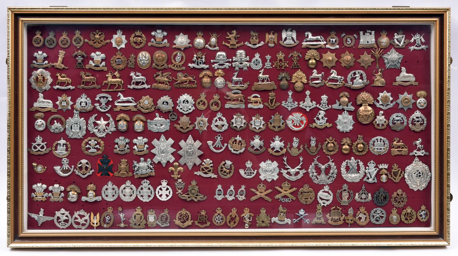 An attractively framed collection of 185 British military cap badges, comprising 38 Cavalry,