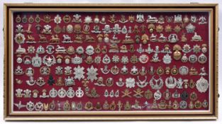 An attractively framed collection of 185 British military cap badges, comprising 38 Cavalry,