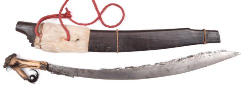 A Borneo sword Mandau, probably made for the tourist trade, blade 24” with pierced back edge, the