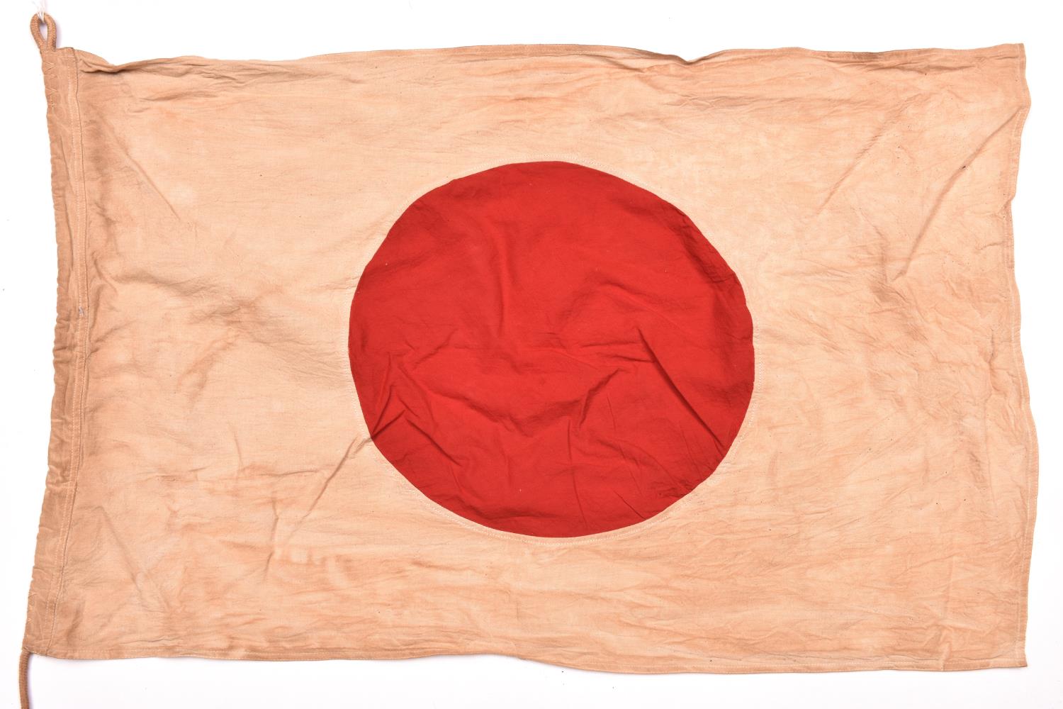 A Japanese military flag, 34” x 22”, white with applique red sun. GC £50-60.