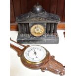 A large slate mantel clock with gilt face and fluted pillars. American Ansonia Clock Co. movement,