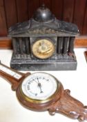 A large slate mantel clock with gilt face and fluted pillars. American Ansonia Clock Co. movement,