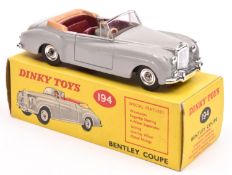 Dinky Toys Bentley Coupe (194). In light grey with maroon interior with fawn tonneau, complete