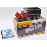 A First Gear 1:25 scale International 'S' Series Dump Truck. Presented in red with a black body.