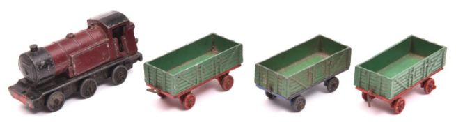 Dinky Toys Tank Goods Train Set. Maroon/black locomotive, two green/red open wagons, with a third