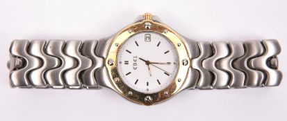 An Ebel Sportwave watch with quartz movement, brushed stainless steel case and bracelet, gold