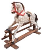 A traditional English children's hand carved wooden rocking horse. This half size horse has been