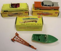 3 Dinky Toys. Cadillac Tourer (131). In yellow with cerise interior and cream wheels with black