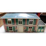 A Mettoy Playthings Metal (tinplate) Dolls House & Garage (6255). A very good example of this