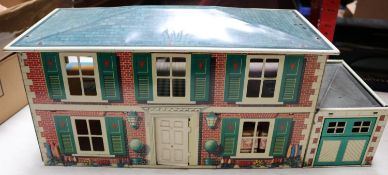 A Mettoy Playthings Metal (tinplate) Dolls House & Garage (6255). A very good example of this