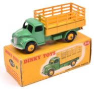 A Dinky Toys Dodge Farm Produce Wagon (343). With mid green cab and chassis, yellow body with yellow