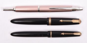 A Pilot Decimo capless vanishing point fountain pen in champagne. Together with a Parker Duofold and