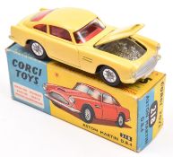 Corgi Toys Aston Martin DB4 (218). A scarce example in yellow with red interior, closed bonnet vent,