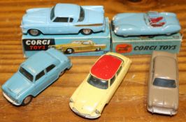 5 Corgi Toys. Studebaker Golden Hawk (211). In light blue with gold flash, boxed, outer end flap