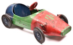 A late 1950's early 1960's Tri-ang Childs Peddle Car. A heavy tinplate toy in the style of a Vanwall