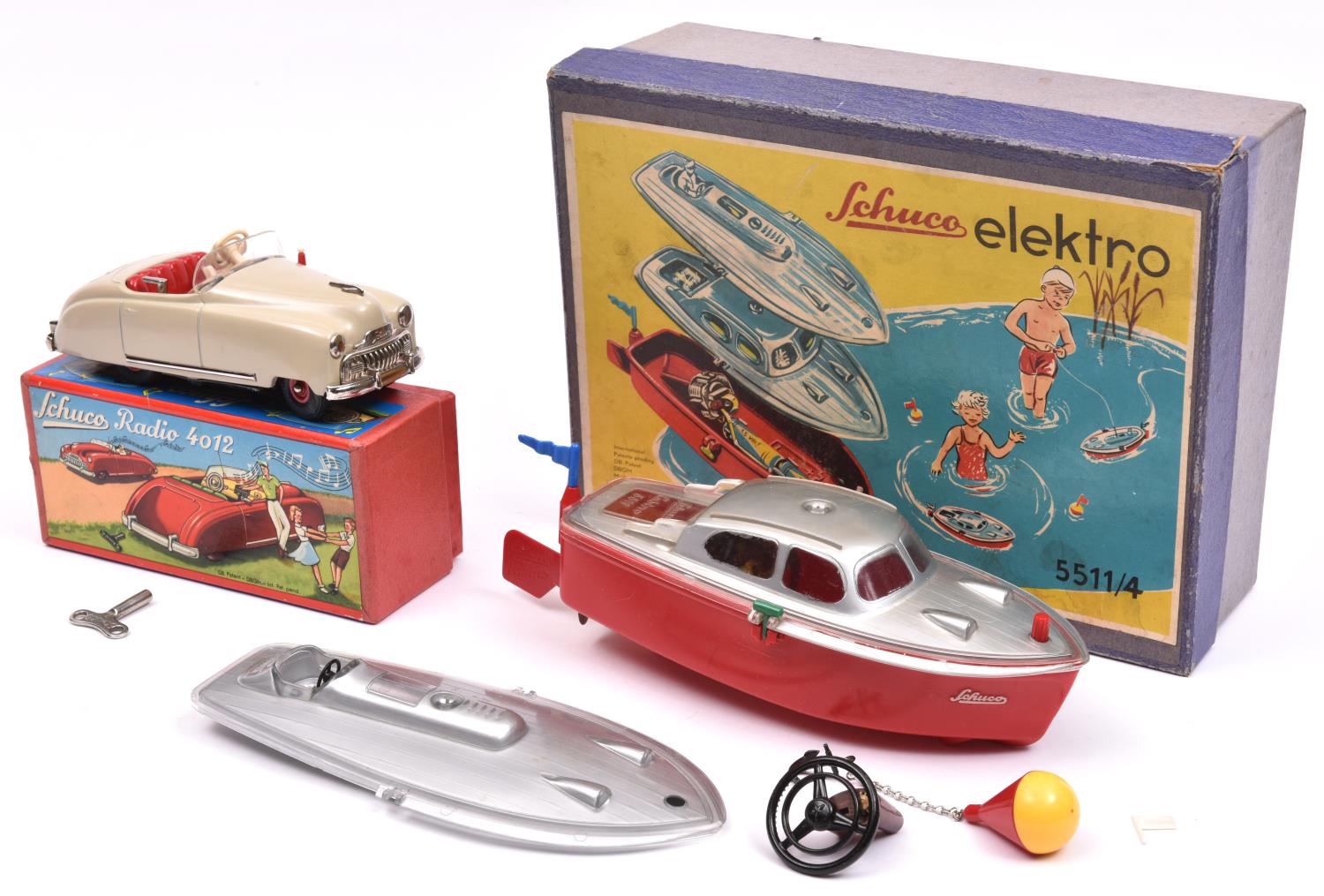 2 original Schuco Toys. An Elektro 5511/4. A battery powered boat with two interchangeable tops, one