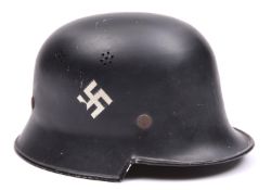 A Third Reich M34 Police light weight square dip helmet, black with white swastika and diagonal