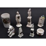 8 very good crested china items, comprising: War Memorial surmounted by Tommies (Matlock); a similar