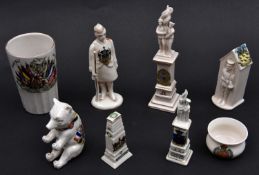 8 very good crested china items, comprising: War Memorial surmounted by Tommies (Matlock); a similar