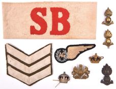 A small quantity of military insignia: red felt on white linen “SB” armband; RAAF Air Gunner’s