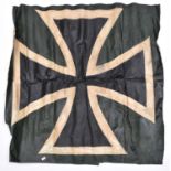 A sheet of fabric, possibly from WWI, 34” x 34”, painted with a black and white German Cross,