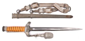 A Third Reich Army officer’s dagger, by WKC Solingen, with grey metal hilt, orange grip, and