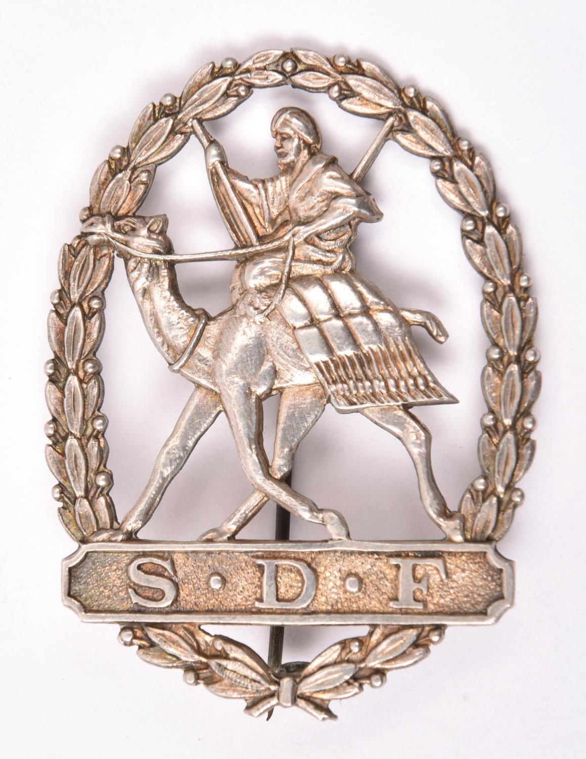 An Officer’s hall marked silver (1930) turban badge of the Sudan Defence Force, 2¼” x 1¾”, mounted