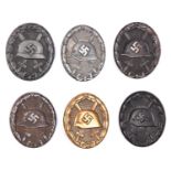 Six Third Reich wound badges: 3 black hollow back steel (one rusted and lacking its pin); black
