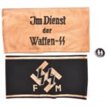 2 Third Reich printed armbands, Im Dienst Der Waffen SS and black with SS runes above “FM”; also