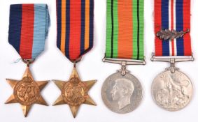 Four: 1939-45 star, Burma star, Defence, War medal with MID emblem (un-named as issued) with