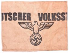 A Third Reich Volksturm armband, cream coloured fabric and printed in black with “Deutscher
