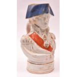An old glazed earthenware “character” jug in the form of Admiral Nelson, wearing medals and