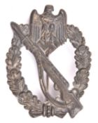 A Third Reich Infantry Assault badge, of grey metal with faint traces of silver finish, the back