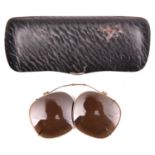 A pair of WWII dark glass clip on covers for glasses, reputed to be Afrikakorps, with adjustable