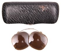 A pair of WWII dark glass clip on covers for glasses, reputed to be Afrikakorps, with adjustable