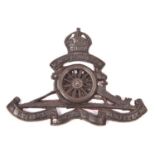 An officer’s cast bronze cap badge of the Warwickshire Royal Horse Artillery, GC (one prong missing,