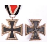 A Third Reich Iron Cross 1st Class, of one piece non ferrous construction (slightly worn); and an