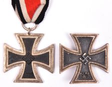 A Third Reich Iron Cross 1st Class, of one piece non ferrous construction (slightly worn); and an