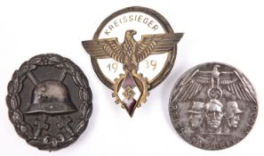 A Third Reich Hitler Youth Kreissieger 1939 enamelled pin back badge (possibly a copy); a solid flat