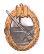 A Third Reich Coastal Artillery badge, with maker’s mark “FLL” in trefoil over “43” (Friedrich