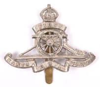 An OR’s white metal cap badge of the First Hants Royal Garrison Artillery Volunteers, with