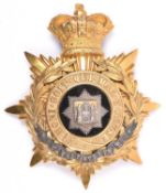A Victorian Officer’s helmet plate of the East Surrey Regiment, gilt silver star badge to centre and