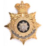 A Victorian Officer’s helmet plate of the East Surrey Regiment, gilt silver star badge to centre and