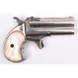 A .41” rim fire double barrelled over and under Remington Derringer pistol, number 357, hinge up