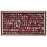 An attractively framed collection of 185 British military cap badges, comprising 38 Cavalry,