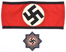 A Third Reich SS cloth arm band, with sewn in cloth labels bearing RZM and SS symbols and marked “